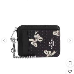 Coach wristlet wallet with silver hardware and bows